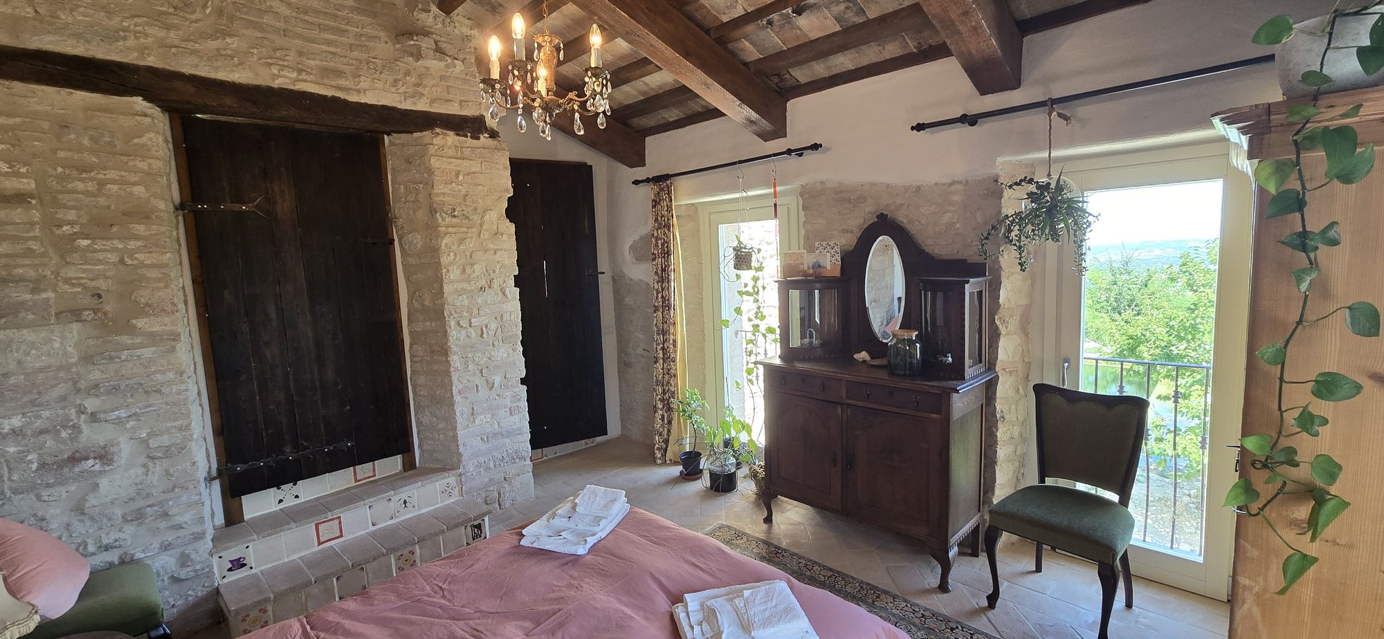 The View — original wooden shutters in the stone wall