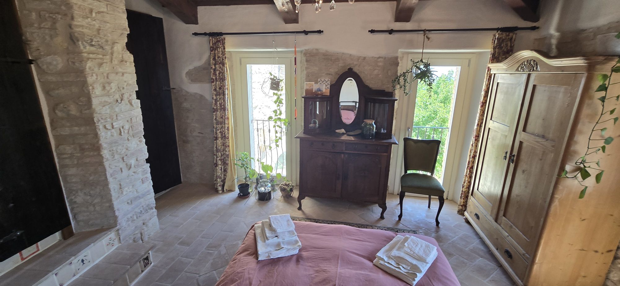 The View — antique dresser between the two tall windows